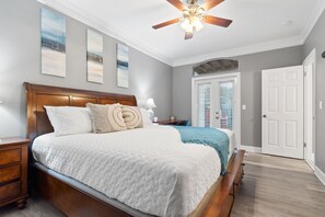 Master bedroom with king bed on main level and walkout