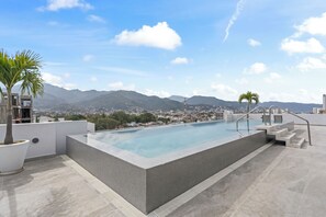 Welcome to the rooftop - where city views meet poolside serenity.