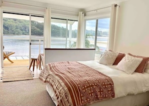 Enjoy the tranquil waters of Fisherman’s Bay from your bed