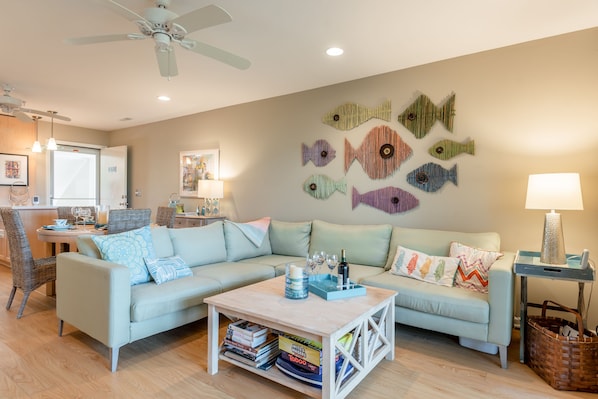 Living Room that leads out to the top floor balcony. Love this artwork!