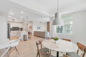 The condo features a modern, open-concept layout with plenty of natural light.