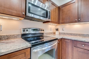 Stainless steel appliances, including a dishwasher and wine fridge