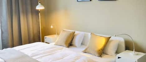 Soft and cozy double bed with pillows to have a good night sleep during your stay.