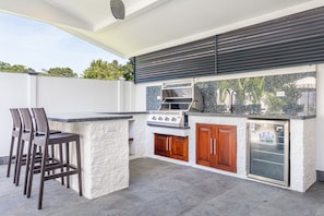 Outdoor patio, grill and bar space. 