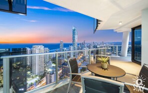 Marvel at the breathtaking scenery of the ocean and the city from the balcony