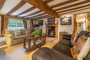 Ground floor: Sitting room with electric living flame stove