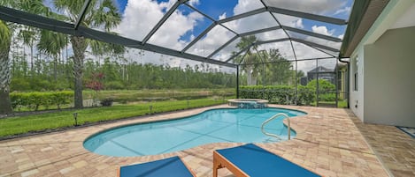 Villa Paradise at The Preserve - The screened in pool area offers lake and preserve view