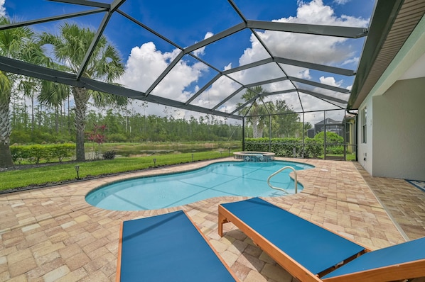 Villa Paradise at The Preserve - The screened in pool area offers lake and preserve view