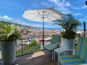 Enjoy the private balcony with mountain and water views
