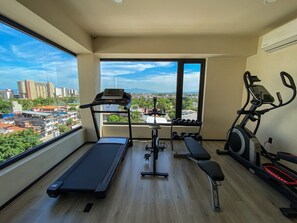 The gym is located on the rooftop and has a nice view