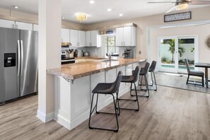 Kitchen Oasis: Bright granite counters and modern appliances make cooking a breeze! Enjoy sunny views!