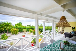 Large porch with seaview with dining and lounge area