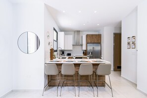 Fantastic Kitchen of the 2BR condo in Noord Aruba - Fully Equipped - Thoughtful placement of kitchen essentials for easy access - Breakfast Bar