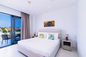 Main bedroom with king bed and attached bathroom