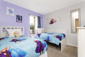 Delight your kids with this charming Frozen-themed bedroom, complete with comfy twin beds.