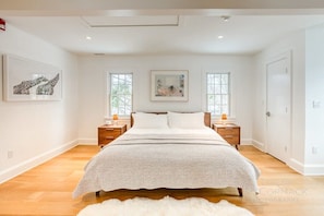 Bright and airy primary bedroom with king bed. All linens and towels are Annie Selke & Parachute brand.