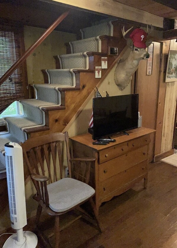 Steps take you to the loft upstairs with beds.