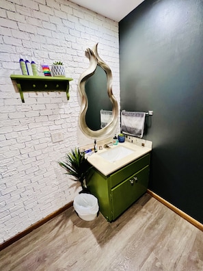 The cutest bathroom with standing shower. Essentials provided.