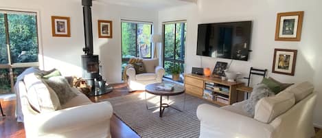 Living Area with wood burner. Ducted Heating & Cooling throughout house.