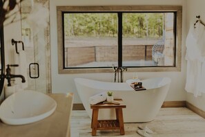 Our cabin has beautiful bathrooms with deep, soak- in bathtubs that are the perfect way to rejuvenate after a long day of exploration