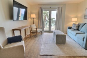 Living room featuring Gulf and palm tree views. 