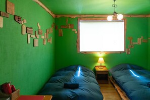 The green room studded with wooden tiles is a monolith.