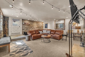 The lovely exposed stone walls will catch your eye as soon you step inside the home and is a unique detail that is featured throughout the home