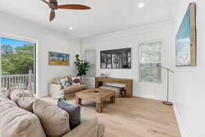 This comfy living room offers space for everyone to gather!