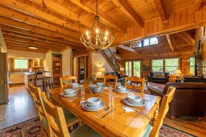 Dine under the antler chandelier and stunning knotty pine ceilings