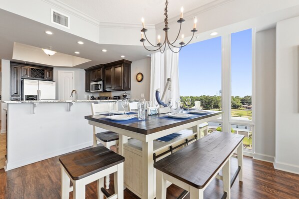 Floor to ceiling windows brings in all the natural light while your family dines