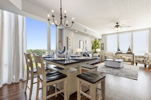 Open concept view from dining table into the living room. Space for everyone. 