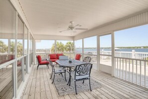 Screened in porch facing Little Lagoon.