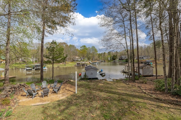 Private cove w/ minimal boat traffic. View from deck, steps to the lake.