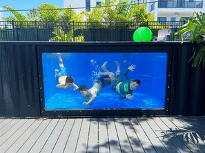 Enjoy the only shipping container pool in Florida with a huge window and hot tub