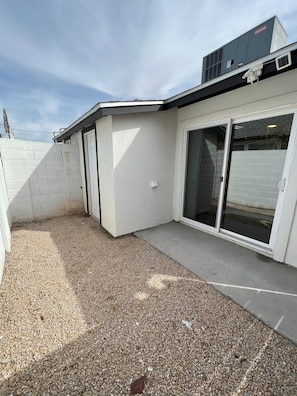 Private patio next to laundry room.