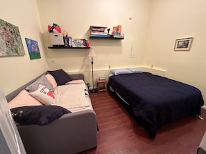 Secondary bedroom in main cottage, queen and full beds.