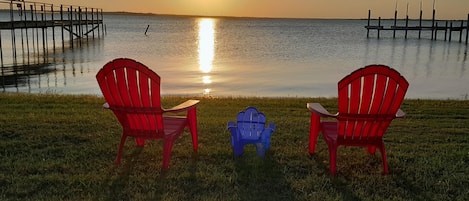 Sit on the shore and watch the sunset.