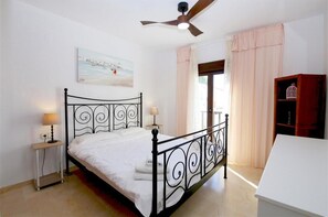 Master bedroom with en-suite bathroom and king-size bed