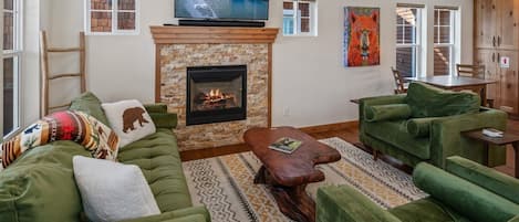 Living area with gas fireplace and tv