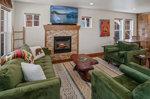 Living area with gas fireplace and tv