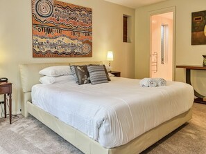 Master bedroom with large windows and access to the garden. Black out blinds make this the ideal parent retreat.