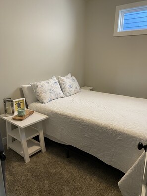Downstairs bedroom with queen bed