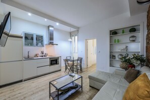 View of the living room space, dining room space and kitchen