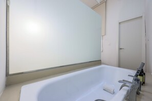 View of the bathtub area in the room