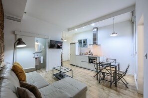 View of the living room space, dining room space and kitchen