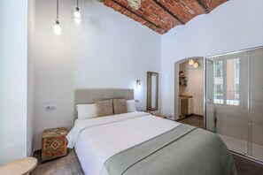View of the bedroom with a double bed and a shower tray