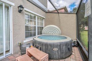 Screened patio with hot tub and lake view