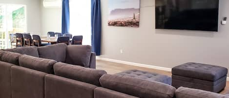 Two sectionals provide all the seating you need to relax and watch the 75" TV.