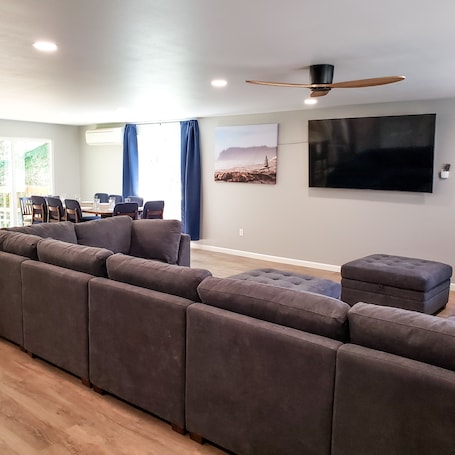 Two sectionals provide all the seating you need to relax and watch the 75" TV.