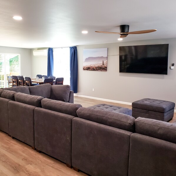 Two sectionals provide all the seating you need to relax and watch the 75" TV.